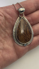 Load and play video in Gallery viewer, video of Large tear drop shaped Biggs Jasper Cabochon in custom Sterling Silver setting