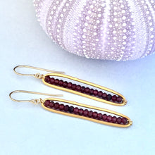 Load image into Gallery viewer, long oval  24kt gold plate over sterling silver earrings faceted garnet beads