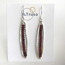 Load image into Gallery viewer, handcrafted sterling silver earrings long ovals faceted garnet on display card