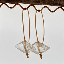 Load image into Gallery viewer, 14kt gold filled wire earrings natural quartz crystal on display