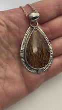 Load and play video in Gallery viewer, video of Large tear drop shaped Biggs Jasper Cabochon in custom Sterling Silver setting 
