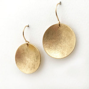 large textured brass earrings disc shape  matte finish side view