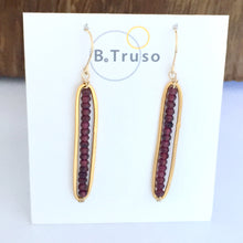 Load image into Gallery viewer, long oval 24kt gold plate over sterling silver earrings faceted garnet beads on card
