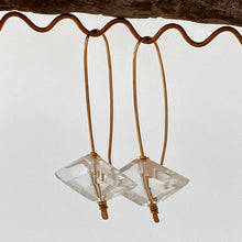 Load image into Gallery viewer, 14kt gold filled wire earrings natural quartz crystal on display
