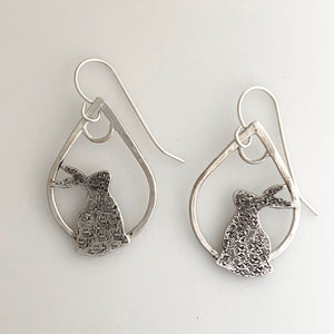 sterling silver earrings with rabbit silhouettes on teardrop hoops
