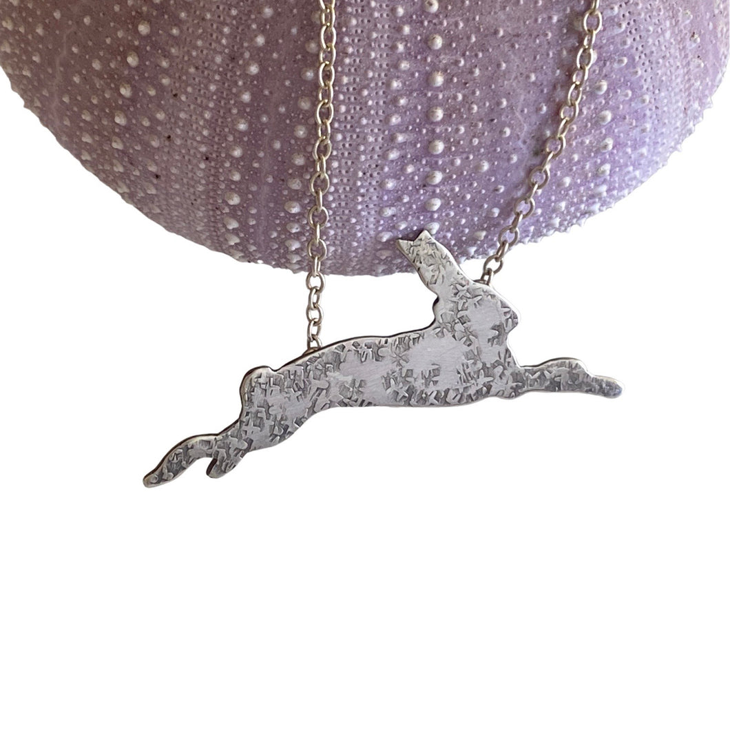 sterling silver pendant of bounding rabbit