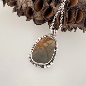 unique handcrafted sterling silver setting around a red creek jasper cabochon made by beth truso